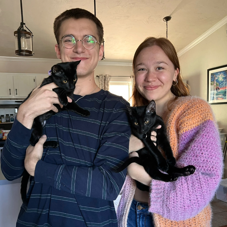 A portrait of my partner, Sarah, and I with our two cats, Lorelai and Frankenstein
